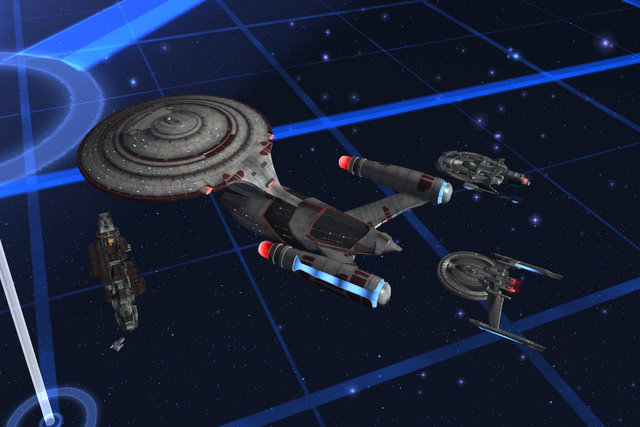 The USS Manchester dwarfs nearby ships.