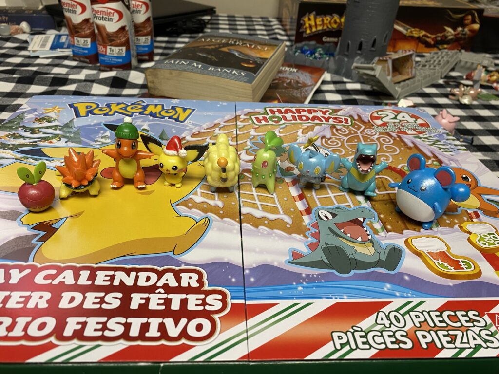 In honor of Shinx joining the crew, the advent calendar Pokémon decide to line up like a rainbow.